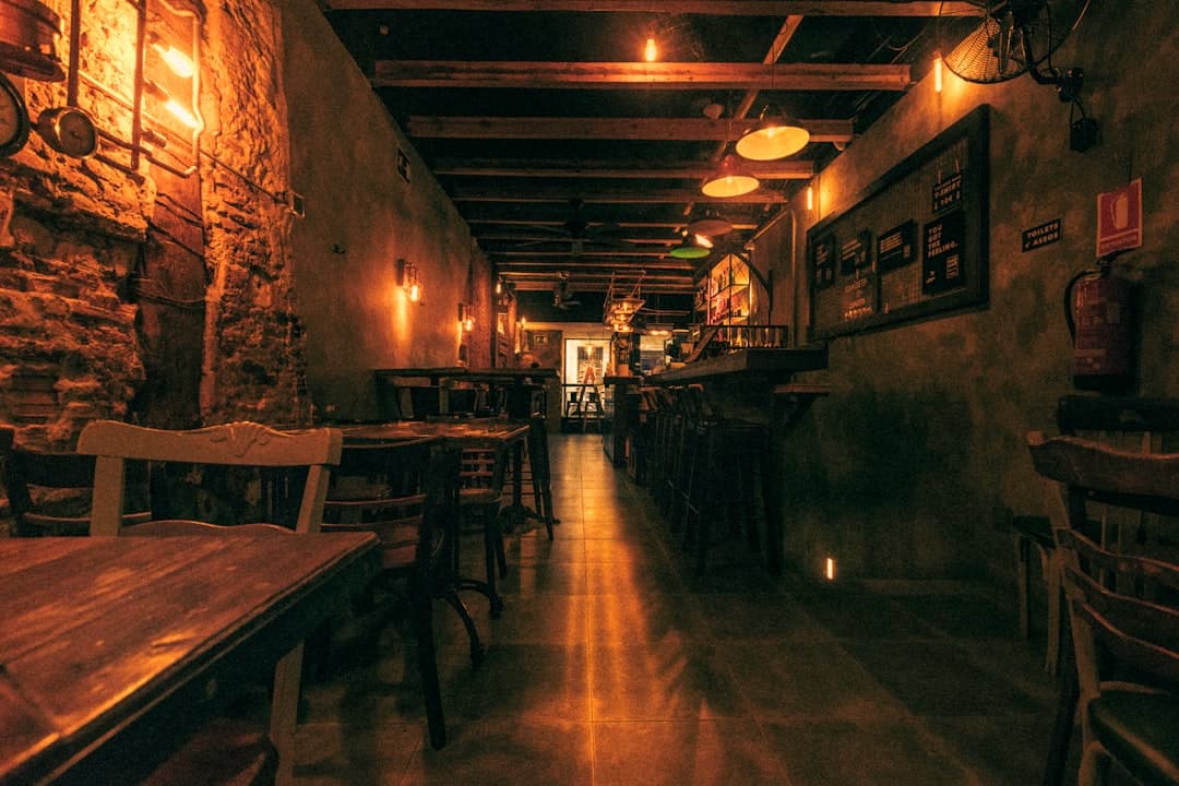 The dim restaurant room late in the evening.